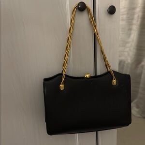Elegant Black Handbag with Gold Accents